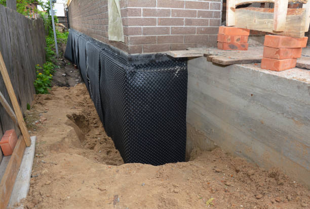 Happy homeowners after waterproofing job in New Lebanon